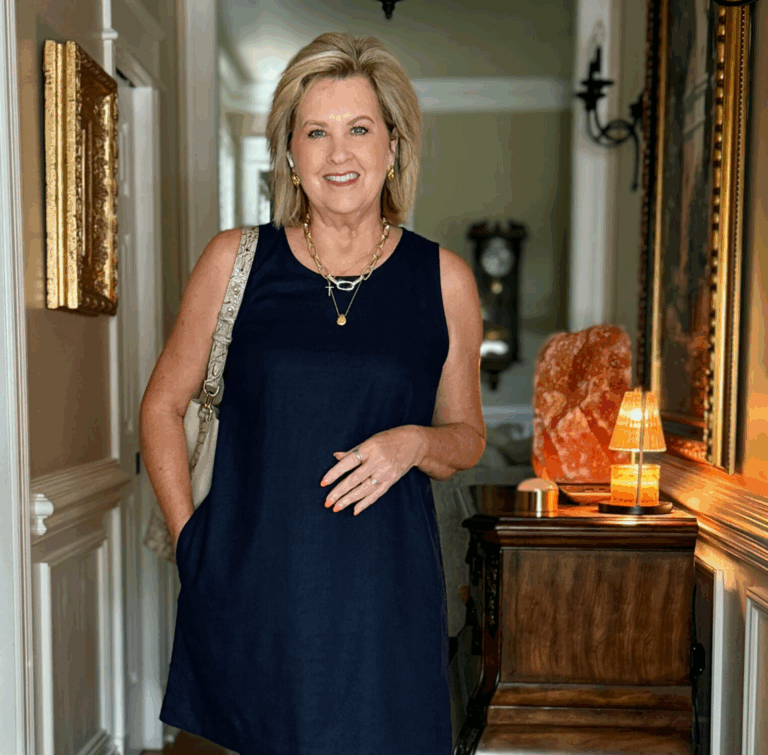 Tania Stephens wearing a navy linen dress and comfortable wedge sandals